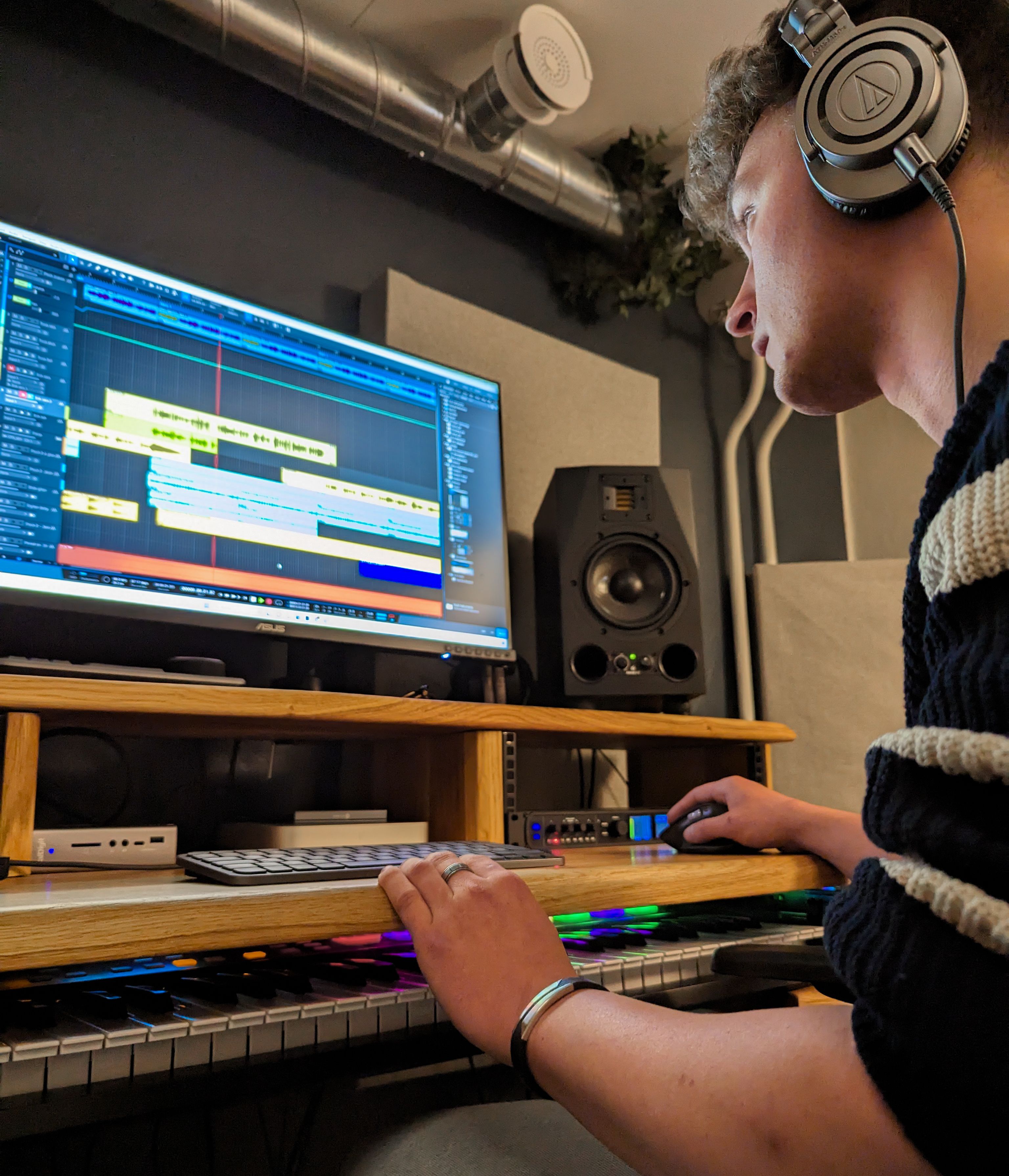 Guy producing music at computer