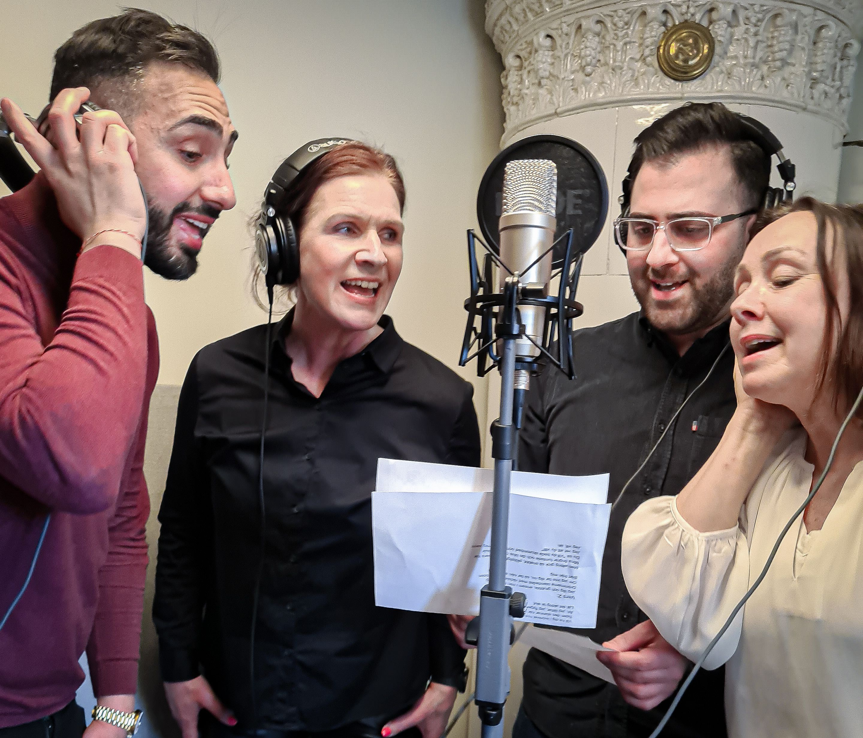 Group singing into a microphone